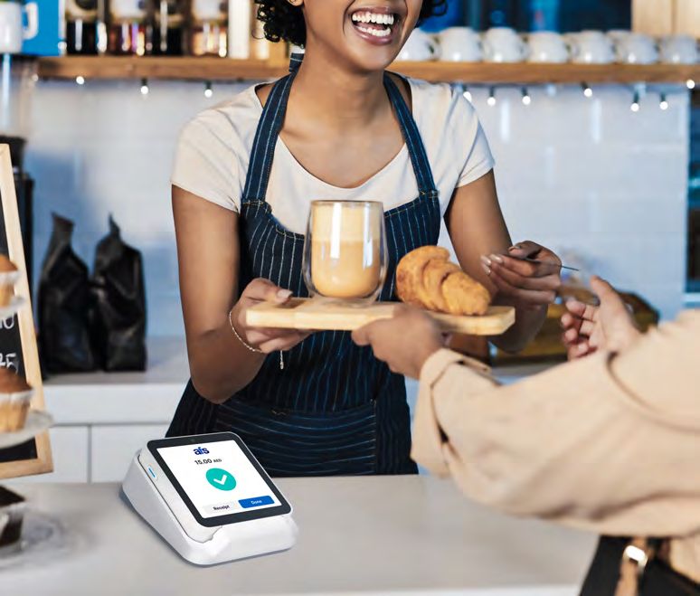 AFS Lite Mini POS on a café counter next to coffee and pastries